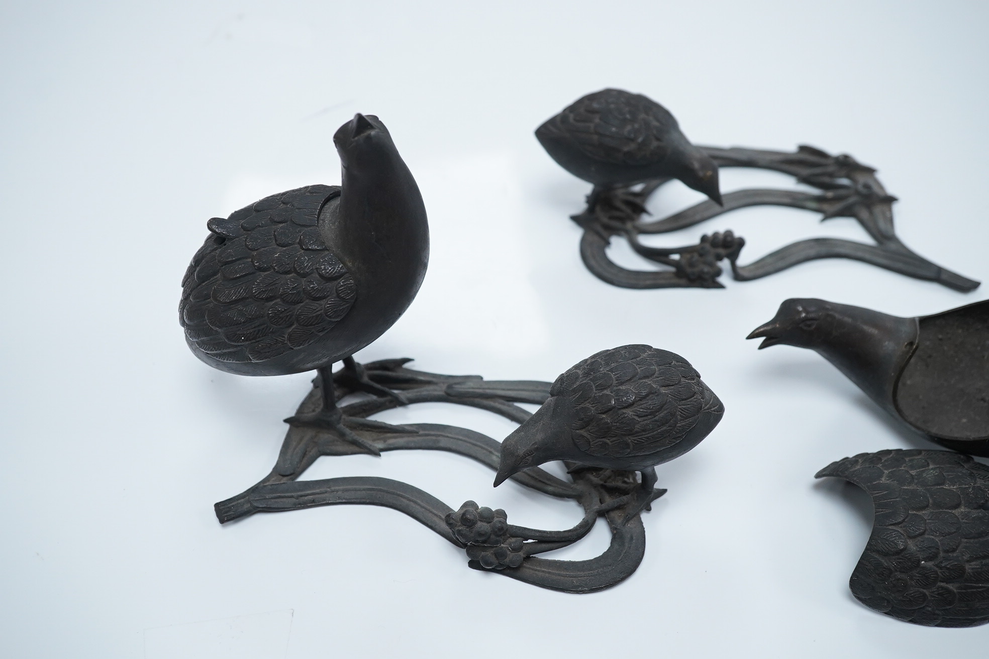 A pair of Japanese bronze ‘quail’ incense burners, 12.5cm tall. Condition - one damaged